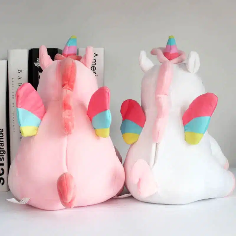 PELUCHE LICORNE LUMINEUSE ROSE AILÉE 8 PELUCHES LICORNE LUMINEUSE ROSE ET BLANCHE AILÉE VU DE DOS
