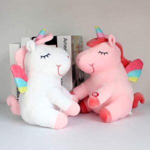 PELUCHES LICORNE LUMINEUSE ROSE ET BLANCHE AILÉE VU DE COTÉ